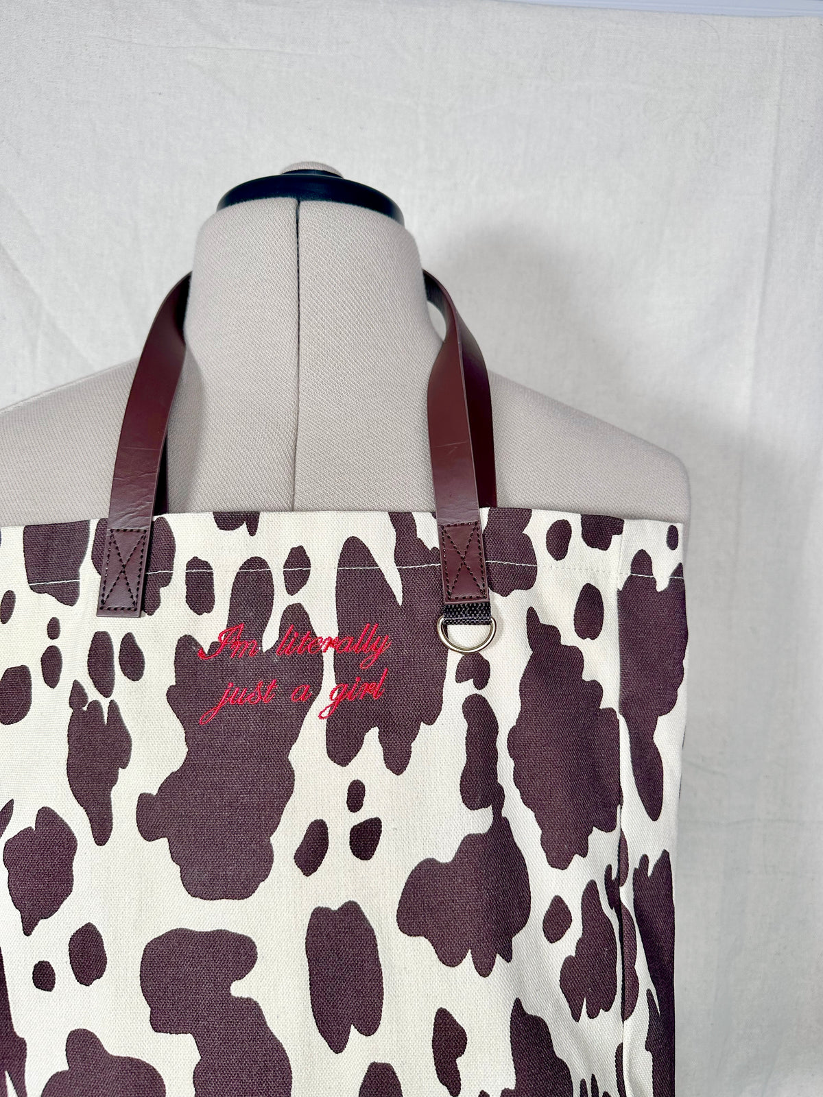 I'm Literally Just A Girl Embroidered Cow Print Tote Bag