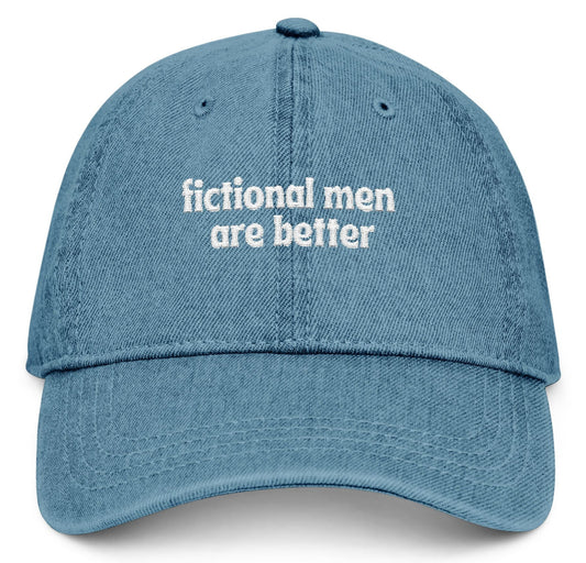 Blue cap with 'fictional men are better' text on a white background