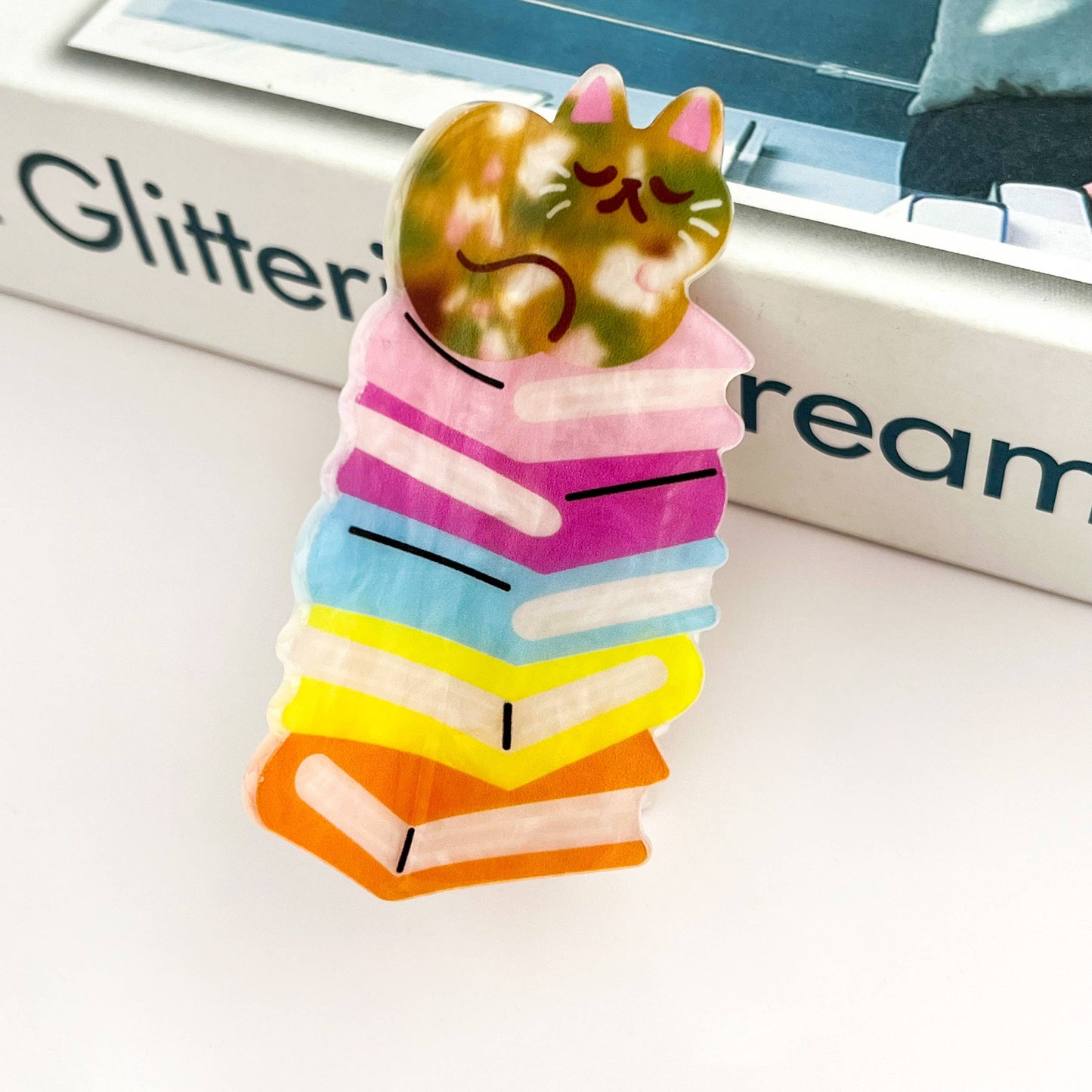 Sleeping Cat on Rainbow Book Stack Hair Claw