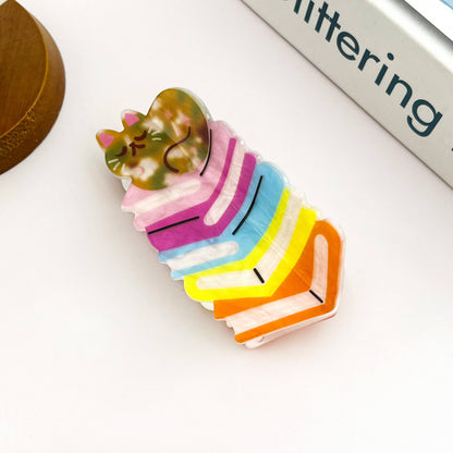 Sleeping Cat on Rainbow Book Stack Hair Claw