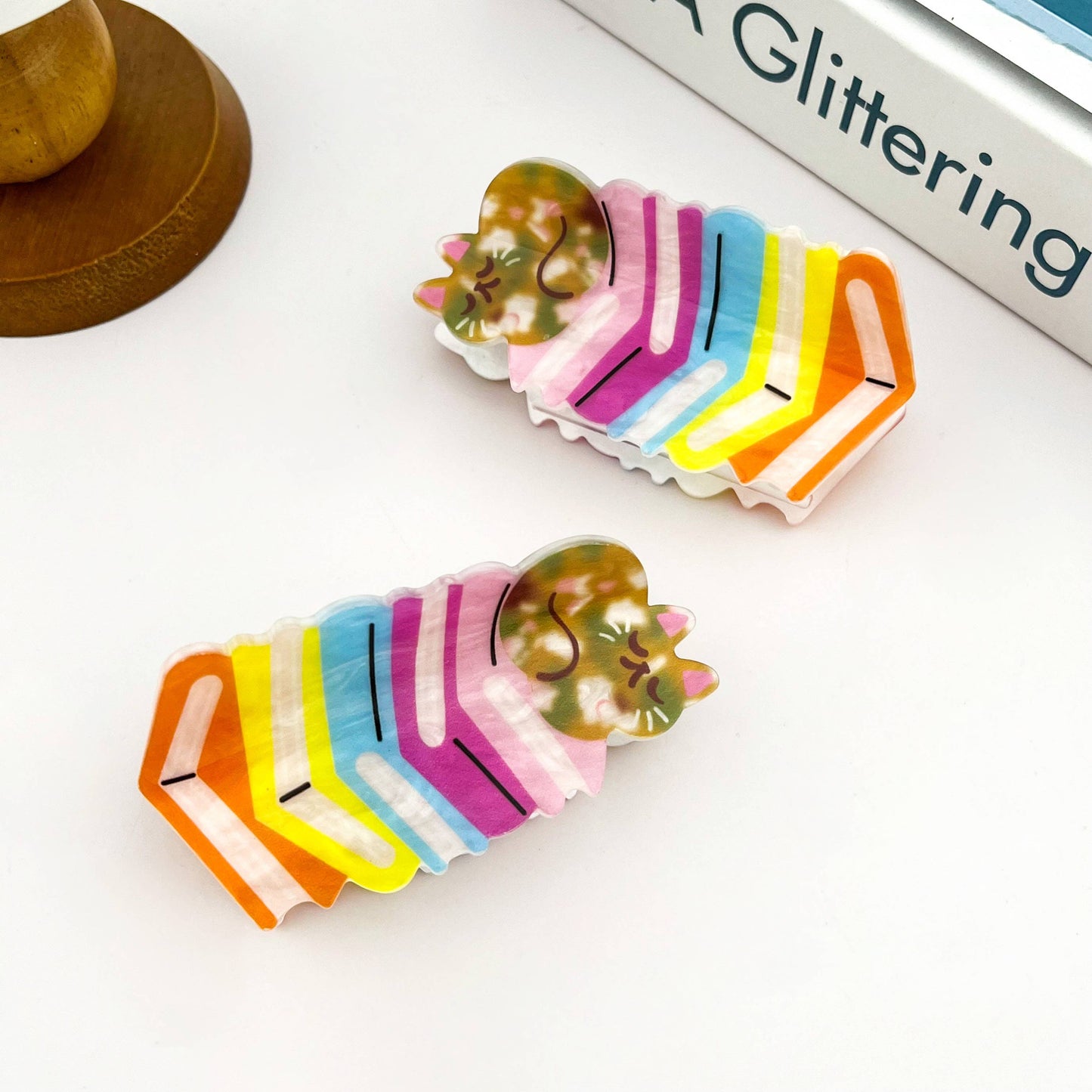 Sleeping Cat on Rainbow Book Stack Hair Claw